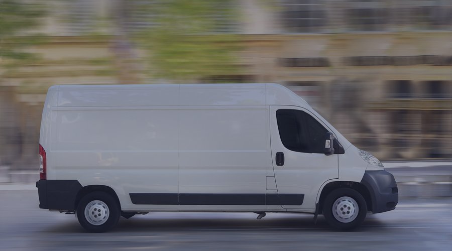 Van driving on the street at a high rate of speed.